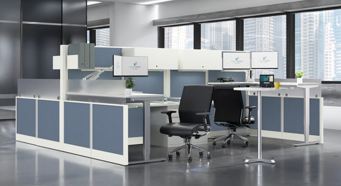 Modern office space co-working cubicle with modular walls, adjustable height desks and ergonomic chairs