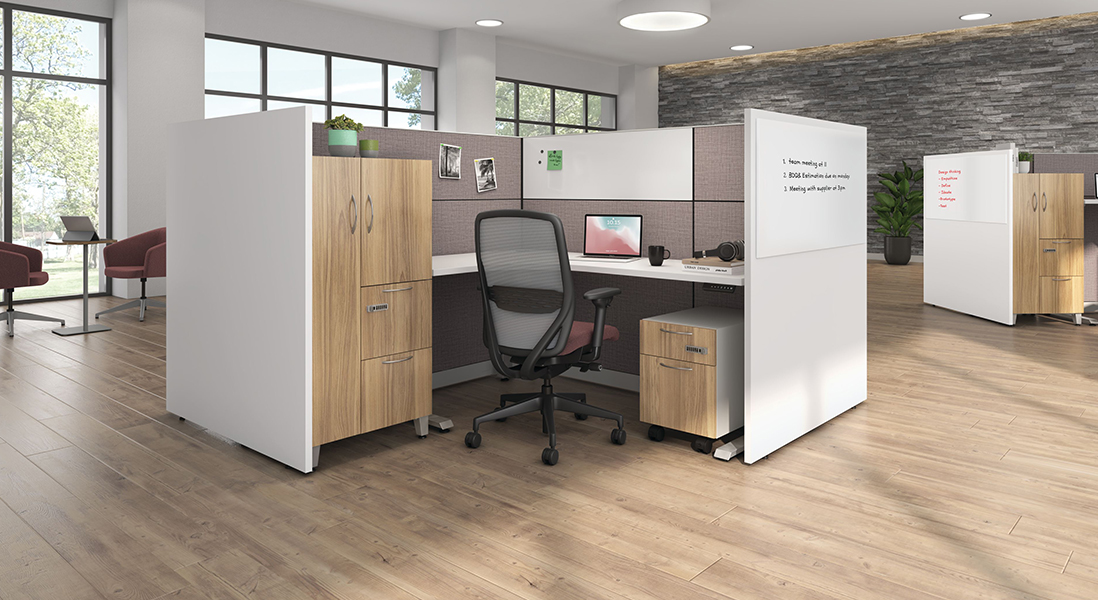 Modern open office space with modular cubicles and open lounge area with unique whiteboard walls and lots of storage