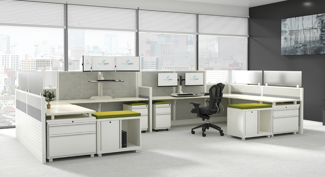 Modern office space co-working cubicle with modular walls, moveable storage, adjustable height monitors and an ergonomic chair