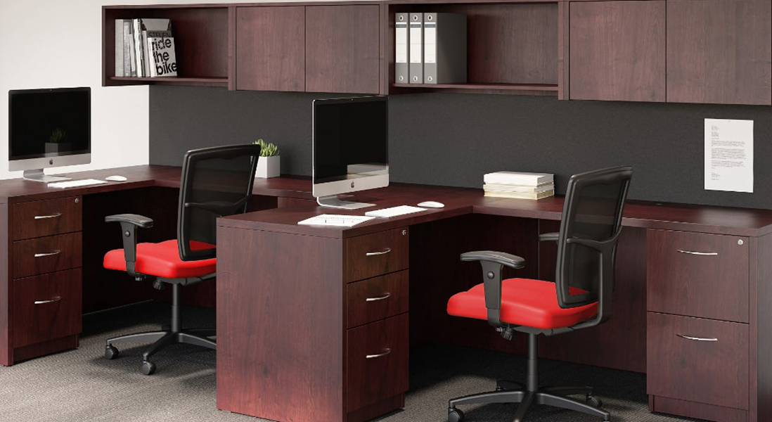 Traditional employee co-working desks with locking storage and overhead easy-access shelving with padded rolling chairs