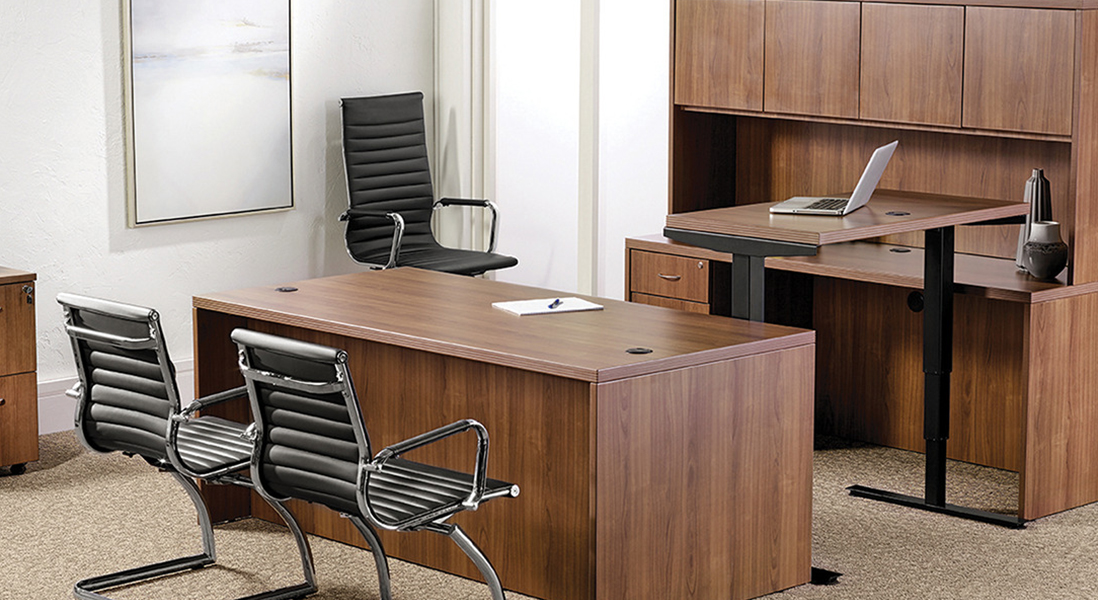 Traditional office space with sit-stand desk and space to meet with clients including storage credenza
