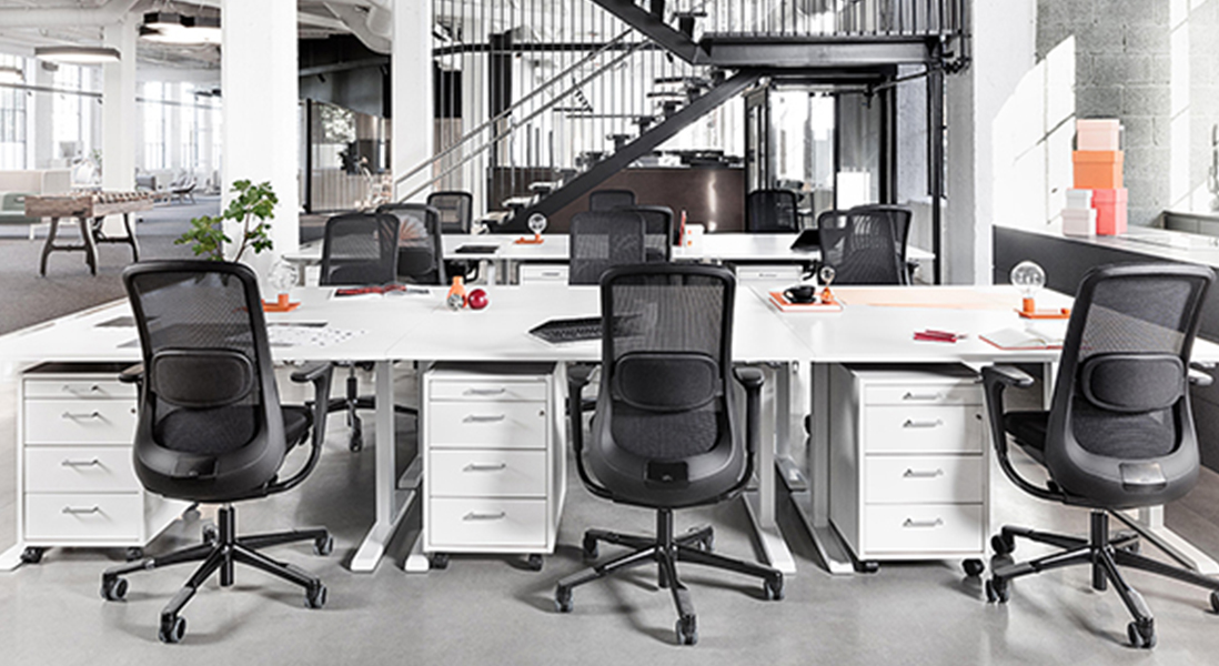 Industrial modern office space with co-working stations and rolling storage and large open lounge areas