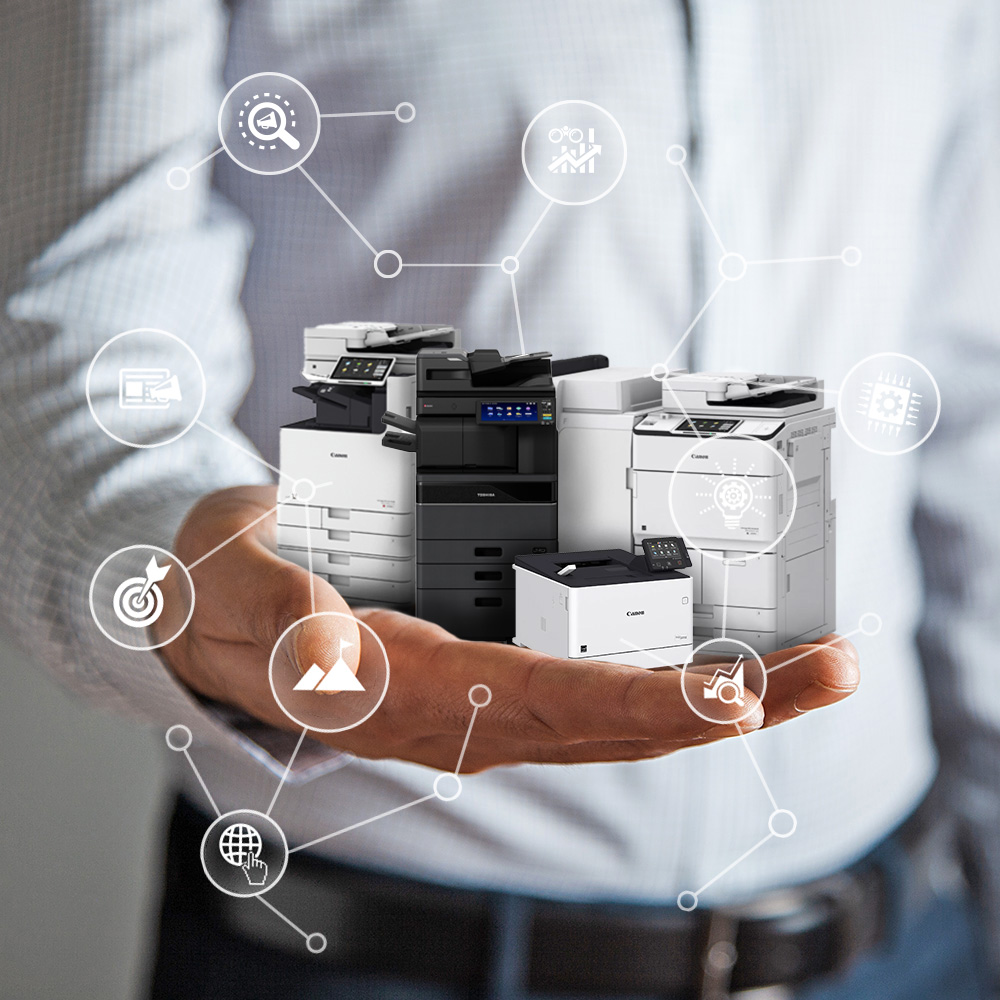 Person holding a variety of artificially miniaturized Canon and Toshiba printers in their hand with overlay graphics symbolizing various technological functions of printers