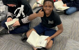 Small group of elementary school aged children reading