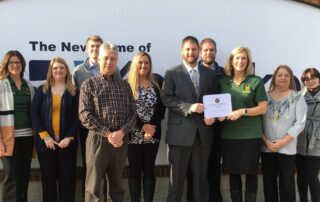 River Bend Business Products employees accepting a certificate from the New Ulm Chamber of Commerce